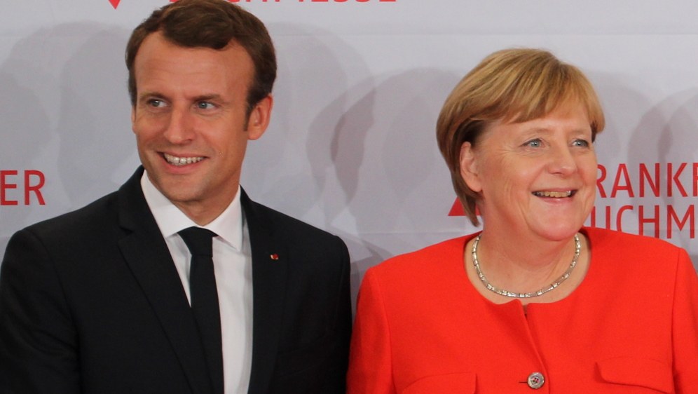 Bündnispartner Macron und Merkel - keineswegs fortschrittlichere Alternative zu den ultrareaktionären, faschistoiden Regierungen in der EU (Foto: ActuaLitté)